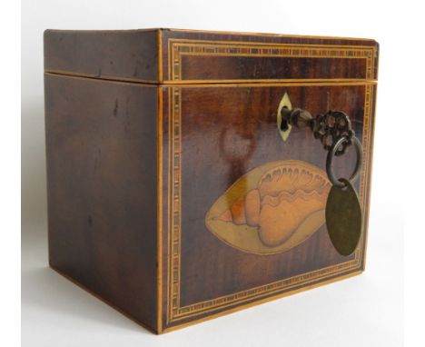 An early 19th Century inlaid mahogany tea caddy with oval shell and foliate paterae, now leather lined and containing later g