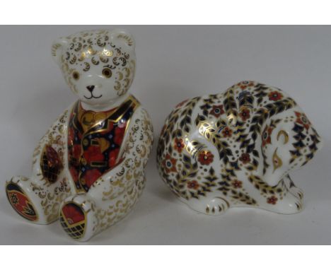 A Royal Crown Derby paperweight modelled as a polar bear sitting, with gold stopper; another modelled as a teddy bear wearing