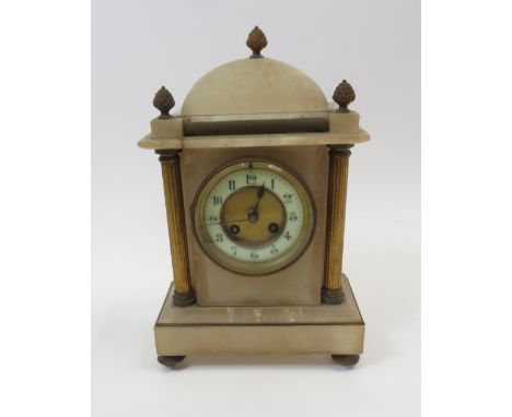 A 19th Century mantel clock in gilt mounted alabaster case and having cream enamel chapter ring, two train movement striking 