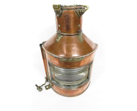 A large copper ships bow/port lamp with original burner stamped Alderson & Gyde Ltd  Brimingham 1945" with clear glass panel 