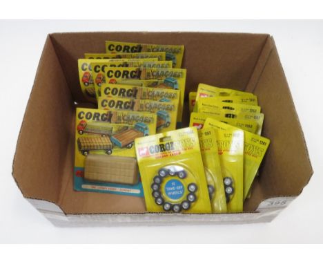 Corgi Cargoes - eight on original cards; Golden Jacks Wheels - nine cards and a pack of Scalextric curve borders