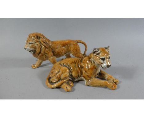 A Pair of Glazed Ceramic Studies of Lion and Lioness, both 21cm Long 