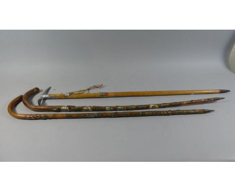 A Collection of Two Alpine Walking Sticks with Souvenir Badges Together with a Ladies Ice Axe 