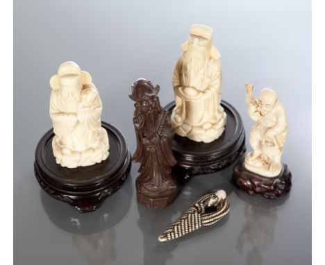JAPANESE CARVED IVORY FIGURE OF A FISHERMAN
on a wooden stand, 11cm high; together with a Japanese ivory netsuke modelled as 