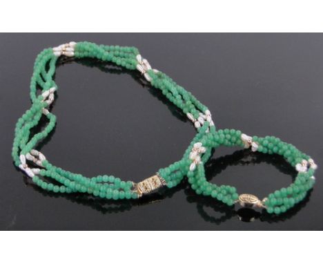 A Chinese jade and pearl bead 4 strand necklace and matching bracelet.