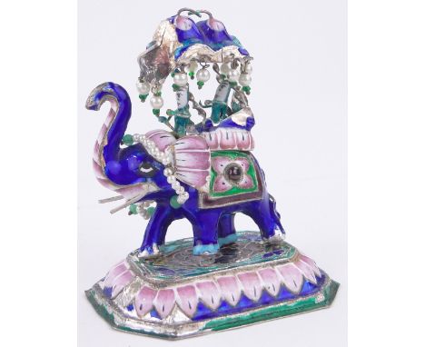 A miniature Indian silver and coloured enamel caparisoned elephant,height 8.5cm.