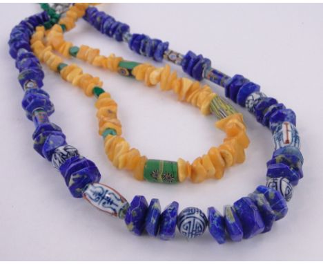 A Baltic amber bead necklace and a lapis and ceramic necklace, (2).