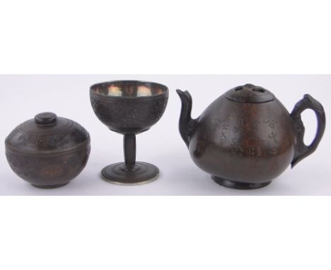 3 Chinese coconut shell items,comprising a stemmed cup with relief carved frieze and silver liner with impressed seal mark, h