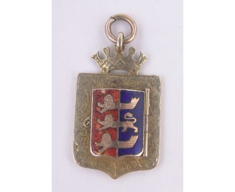 An Edwardian 9ct gold and coloured enamel medallion fob,the cover enclosing a hair panel, inscription verso, dated 1905, heig