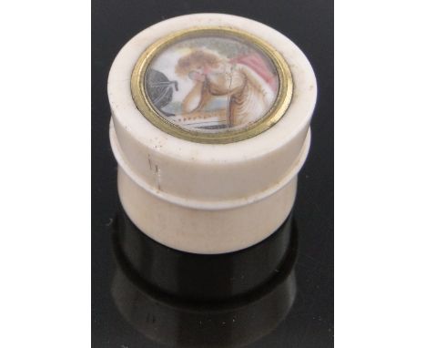 A miniature 19th century circular ivory patch box,the lid having an inset miniature Classical portrait, diameter 25mm.