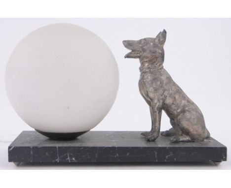 A continental table lamp surmounted by a silvered spelter German Shepherd Dog,base length 23cm.
