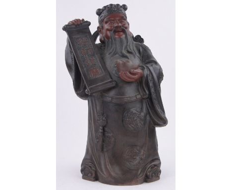 A Chinese terracotta figure of an Immortal carrying a scroll,height 45cm.