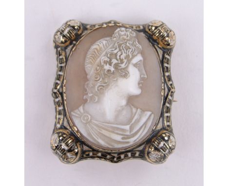 A 19th century carved shell Cameo brooch,classical portrait of a man in unmarked gold and enamel frame, height 35mm.