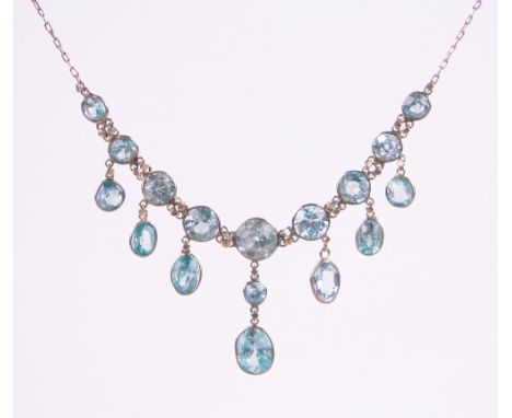 A delicate aquamarine and unmarked gold necklace,total content approx. 5cts, stones light blue/green body colour, old Europea