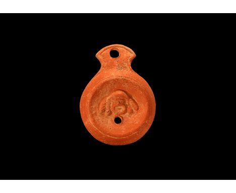 An undated archaistic ceramic redware oil lamp in 2nd-3rd century AD style, with flared nozzle, deep body with angled rim; di