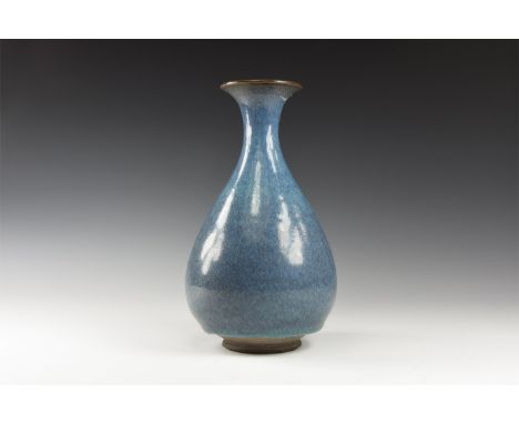 Song Dynasty, 960-1127 AD. A blue-glazed ceramic vase, piriform in shape with trumpet-shaped mouth.  814 grams, 20.5cm (8"). 