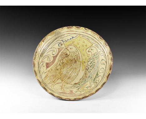 13th-14th century AD. A glazed ceramic bowl with deep body and small foot ring; inside of bowl with cream glaze and decorated