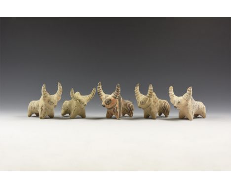A mixed group of undated archaistic ceramic zebu figures with black painted detailing.  529 grams, 90mm (3 1/2"). Property of