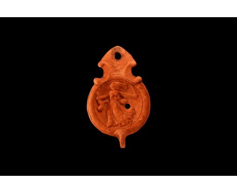 An undated archaistic ceramic redware oil lamp in 1st-2nd century AD style with volute nozzle and loop handle, flat shoulder 