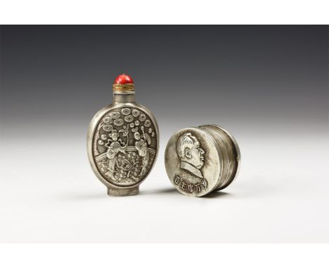 A pair of undated archaistic silver-coloured metal items consisting of; a oval lidded box with portrait of Chairman Mao to th