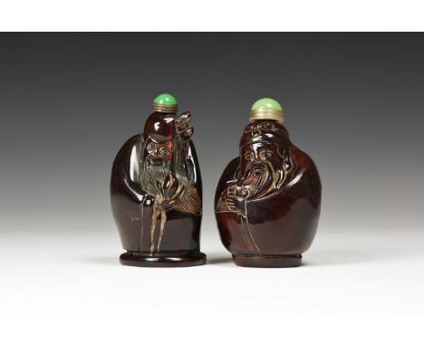 20th century AD. A pair of composition perfume or snuff bottles, each a figure of Shou-Xing with walking stick and abundant b