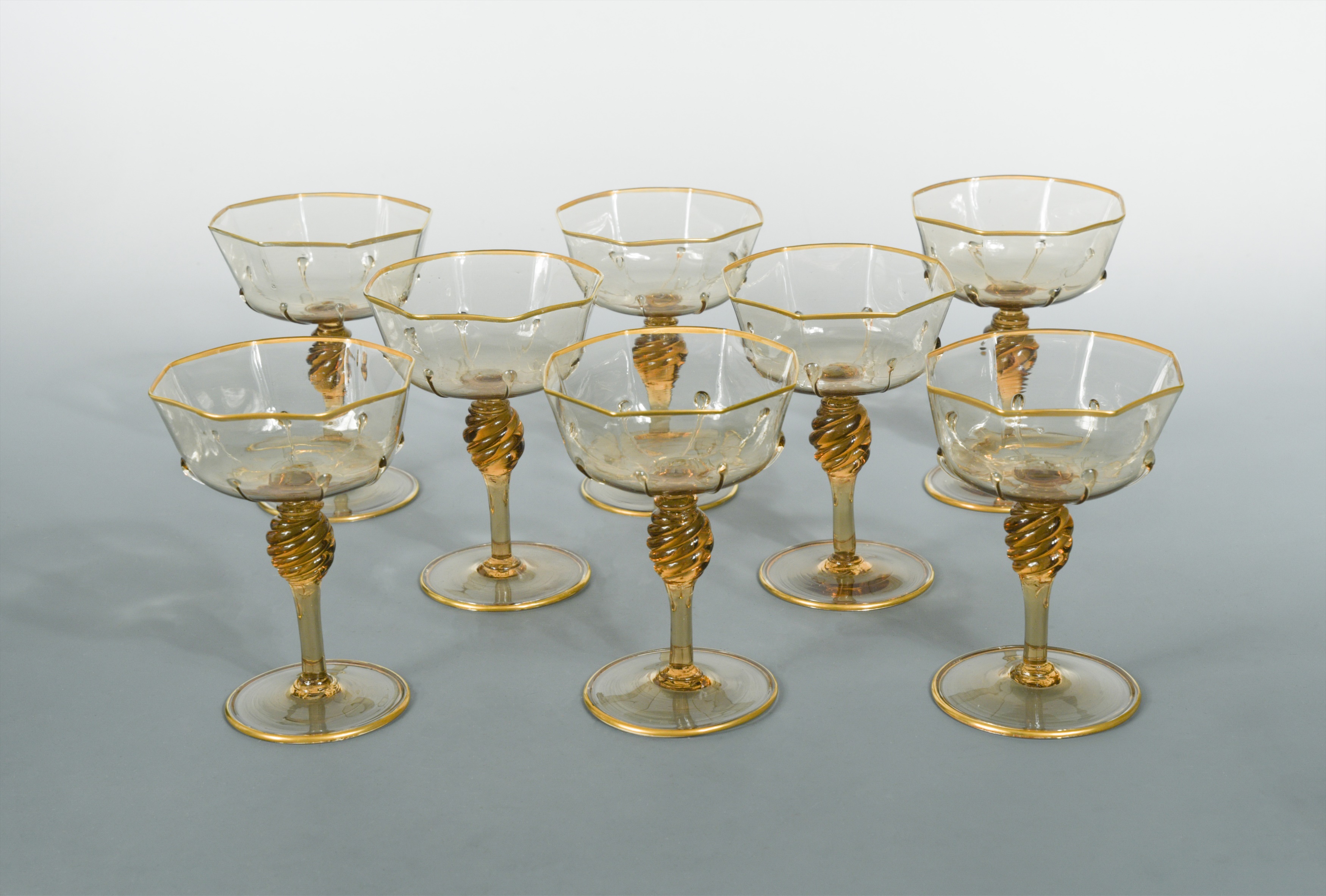 MVM Cappellin, Murano, a set of eight amber glass champagne bowls