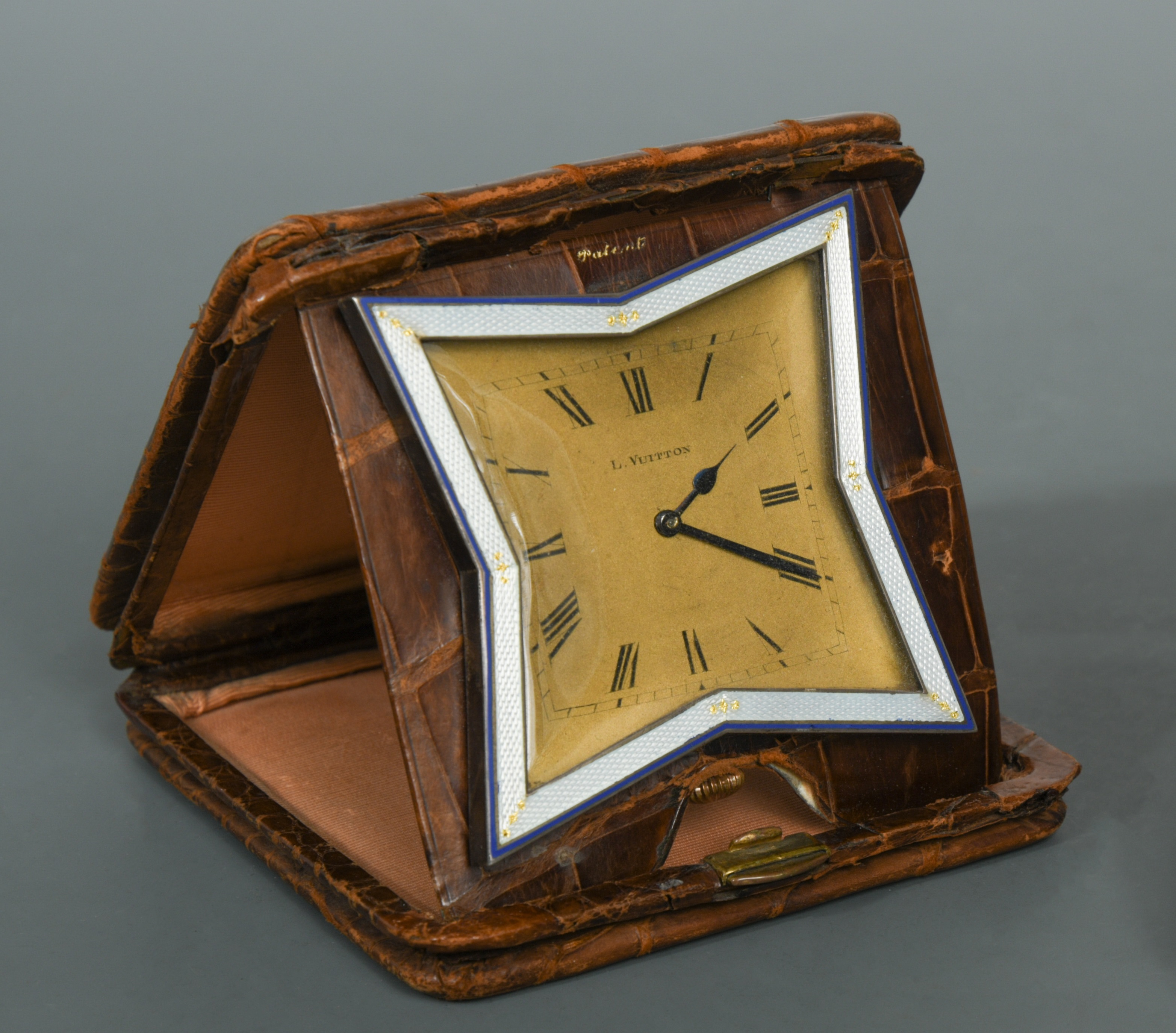 Louis Vuitton, an Art Deco crocodile leather cased travelling clock, in