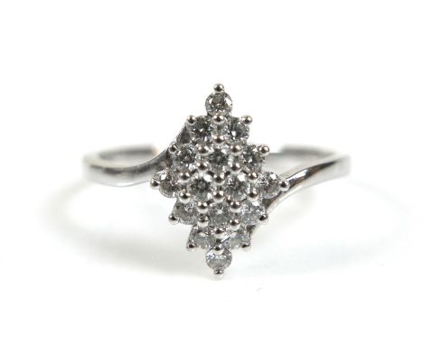 A platinum and diamond cluster ring, round cut stones, each 1.5mm, size O, 3.2g. 