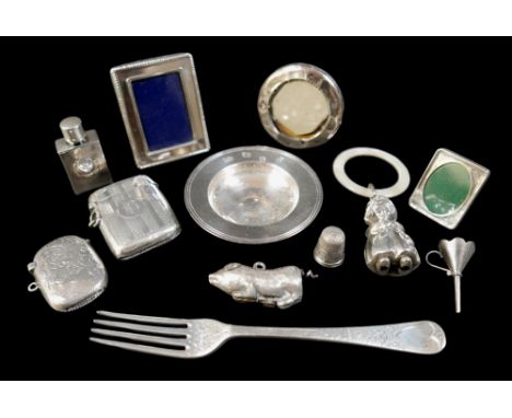 A selection of eleven silver items, to include two vestas, a miniature Armada dish, a photograph frame, a baby's rattle, a fo