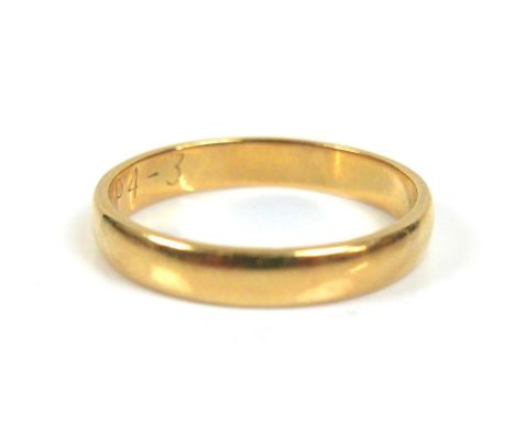 An 18ct yellow gold wedding band ring, 3.1mm wide, size L, 2.4g. 