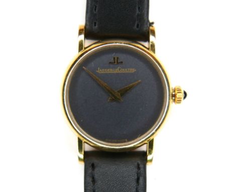 A Jaeger LeCoultre 18ct gold cased lady's wristwatch, model 9201-21, with minimalist grey dial, black cabochon stone set crow