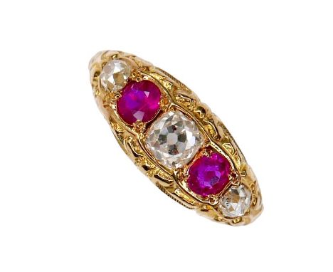 An Edwardian 18ct yellow gold, diamond and ruby five-stone ring, the central oval faceted cut diamond, 4.1 by 3.8 by 3.4mm, f