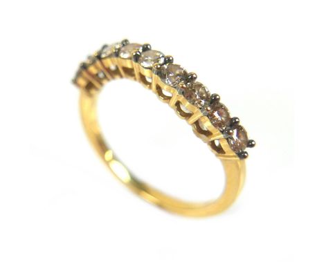 An 18ct gold nine stone diamond ring, each round cut stone approximately 2.5mm diameter, size N, 2.8g. 