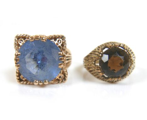 Two gold dress rings, comprising a 9ct yellow gold ring set with a blue round cut stone, 14mm, size P, 8.5g, and an 8ct yello