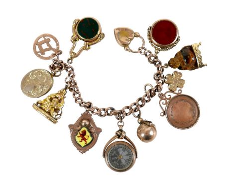 A 9ct rose gold charm bracelet, kerb link with heart shaped clasp, fitted with eleven large 9ct or higher yellow and rose gol
