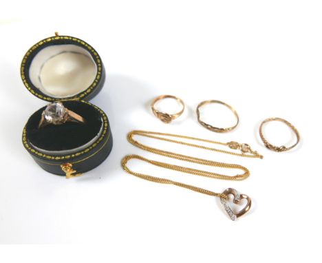 Four 9ct gold rings, comprising a solitaire white stone ring, size L, 2.8g, with oval ring box and three other rings, 2.9g fo