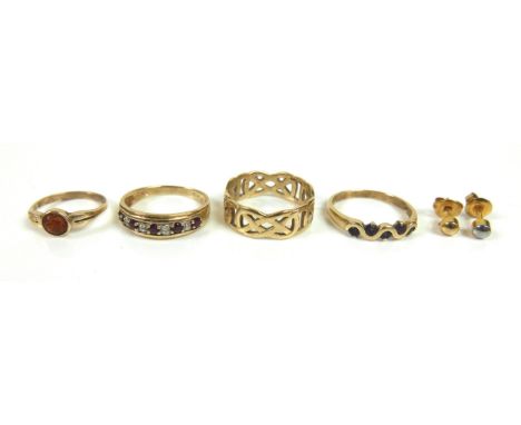 A group of three 9ct yellow gold rings, one with pierced Celtic knot style design, 7.5mm wide, size S, 3.6g, one set with fiv