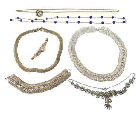 A 9ct gold cased Sekonda lady's wristwatch, case 17mm, on gold plated bracelet strap, and a 9ct gold chain link 'station' nec