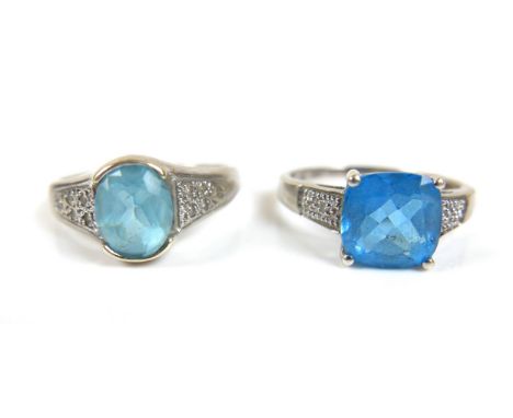 Two 9ct white gold blue stone dress rings, possibly topaz, comprising a square cut stone ring, central stone 9 by 9mm, with a