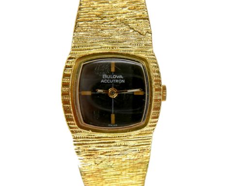 A Bulova Accutron 18ct yellow gold lady's wristwatch, circa 1970's, model 7066, rounded square black dial, gold baton cardina