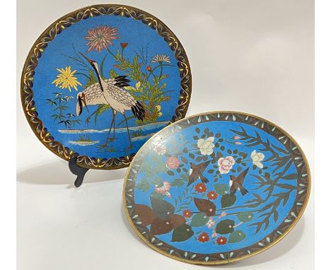 A Japanese Meiji period cloisonne enamel charger, c.1880, depicting cranes and foliage against a blue ground, the reverse dec