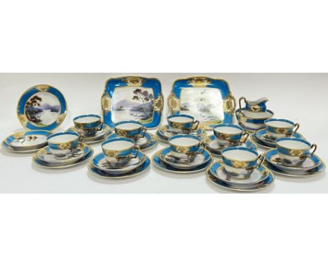 A Noritake tea set decorated with hand enamelled landscape scenes depicting mountains and cattle, the borders with raised gil