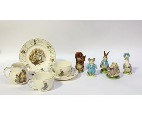 A Wedgwood Barlaston Peter Rabbit pattern part tea service comprising two teacups, a saucer, a plate (w-18cm) and a milk jug 