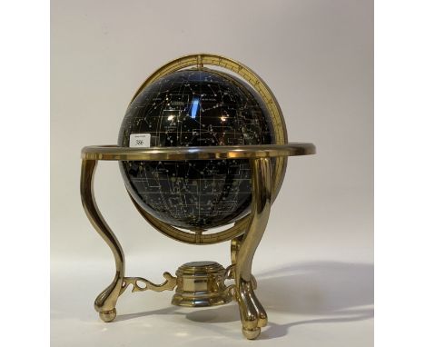 A modern Celestial globe, rotating on a twin axis and standing on a chrome plated tripod base mounted with a compass. H40cm.