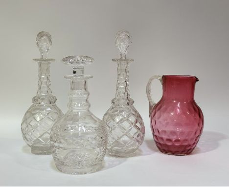 A group of decanters comprising, a Stuart crystal decanter with stopper (h-24cm) a near pair of decanters with cut base and t