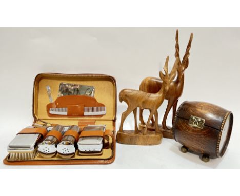 A leather cased gentleman's shaving set with engine turned accoutrements including comb, mirror, brush etc... (w- 25cm), toge