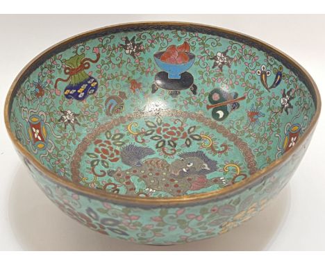 A large Meiji period Japanese cloisonne enamel bowl decorated to the exterior with abstract floral motifs against a turquoise
