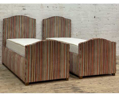 Clockhouse furniture, a pair of bespoke children's single beds, each with arched head and foot board and side rails upholster