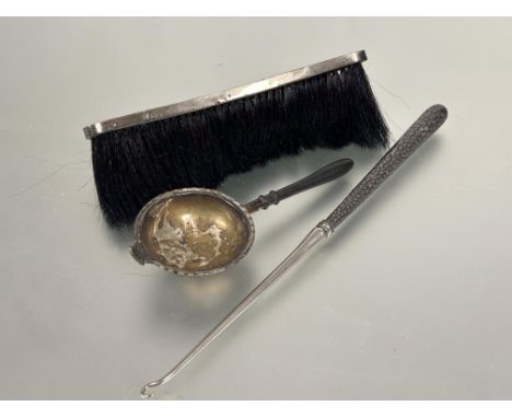 Edwardian Edinburgh silver crescent shaped crumb brush L x 21cm, a Victorian Birmingham silver very long handled button hook 