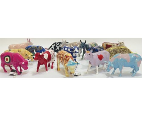 A group of fifteen Cow Parade ceramic cow figures, variously decorated including Broadway/Bullseye designs etc... (all marked